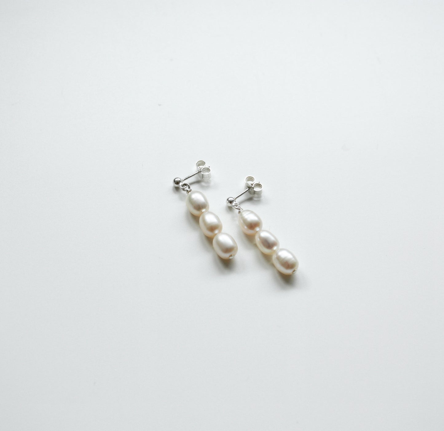 Three Pearl Studs